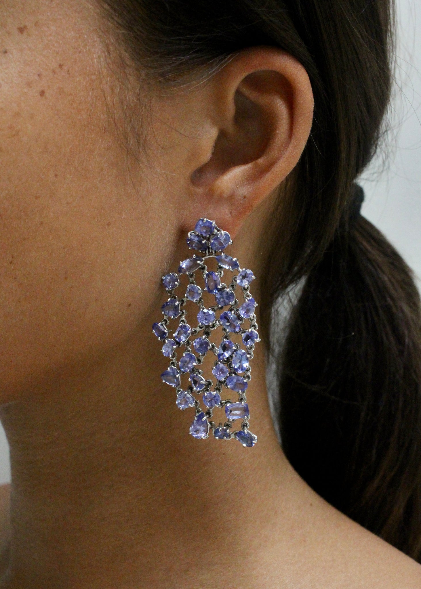 18 krt white gold earrings set with 68 oval Tanzanites